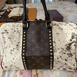 Repurposed Authentic Louis Vuitton and real leather cow hide.. beautiful